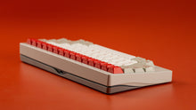 Load image into Gallery viewer, Keyboard with red and white keys on a red background