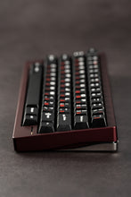 Load image into Gallery viewer, Black keyboard with red accents on a dark surface