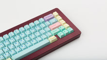 Load image into Gallery viewer, Cherry Flowershop on a maroon nk+ zoomed in on right