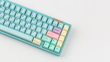 Load image into Gallery viewer, Cherry Flowershop on a blue keyboard zoomed in on right