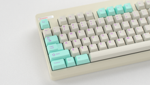 Load image into Gallery viewer, render of GMK CYL Analog Dreams R3 keycaps, close-up on a Classic TKL keyboard with Latin legends and mint accents