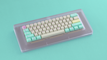 Load image into Gallery viewer, render of GMK CYL Analog Dreams R3 keycaps on a Piggy keyboard, angled full view over a teal background