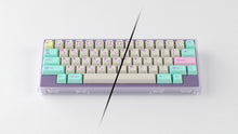 Load image into Gallery viewer, render of GMK CYL Analog Dreams R3 keycaps on a 60% keyboard, split view showing Latin and Japanese hiragana legends in pastel mint, cream, and purple