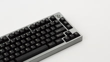 Load image into Gallery viewer, GMK CYL Black Snail on a silver 7V zoomed in on right