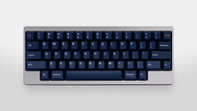 Load image into Gallery viewer, hidden - GMK CYL Blue Fabrik deep navy keycaps with blue-gold legends on silver 60% keyboard