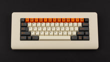 Load image into Gallery viewer, GMK CYL Carbon R3 on a cream colored keyboard top down