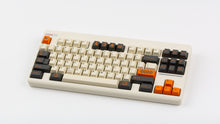 Load image into Gallery viewer, GMK CYL Carbon R3 on a Beige CLASSIC-TKL angled