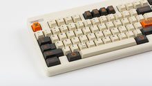 Load image into Gallery viewer, GMK CYL Carbon R3 on a Beige CLASSIC-TKL close up on left side angled
