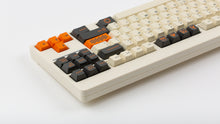 Load image into Gallery viewer, GMK CYL Carbon R3 on a Beige CLASSIC-TKL back view close up on right side angled