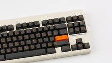 Load image into Gallery viewer, GMK CYL Carbon R3 on a Beige CLASSIC-TKL close up on right side