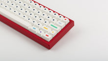 Load image into Gallery viewer, GMK CYL Dots light base on a red keyboard zoomed in on right