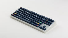 Load image into Gallery viewer, GMK CYL Dots dark base on a clear keyboard angled