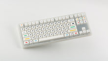 Load image into Gallery viewer, GMK CYL Dots light base on a clear keyboard angled