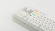 Load image into Gallery viewer, GMK CYL Dots light base on a clear keyboard zoomed in on right back