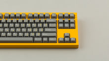Load image into Gallery viewer, GMK CYL FTRO on a Yellow NK87 keyboard close up on right side