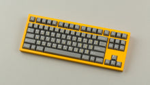 Load image into Gallery viewer, GMK CYL FTRO on a Yellow NK87 keyboard angled
