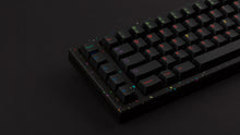 Load image into Gallery viewer, GMK CYL Nachtarbeit on a colorful confetti style back keyboard zoomed in on left