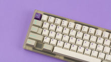 Load image into Gallery viewer, GMK CYL Hyperbeige on a frosted keyboard close up on left side