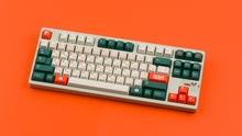 Load image into Gallery viewer, GMK CYL Kaiju Part Deux on speckled beige keyboard angled