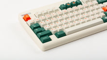 Load image into Gallery viewer, GMK CYL Kaiju R3 hiragana base keycaps close-up of left side with green modifiers on beige keyboard