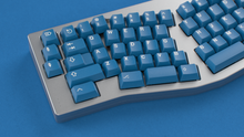 Load image into Gallery viewer, render of GMK CYL Masterpiece R2 keycaps on silver Alice keyboard, close-up view