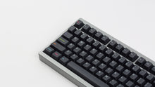 Load image into Gallery viewer, Monokai Material V2 on a grey 7V close up left side