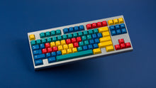 Load image into Gallery viewer, GMK CYL Panels on a silver keyboard angled
