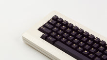 Load image into Gallery viewer, GMK CYL Phantom R2 on a beige keyboard close up on left