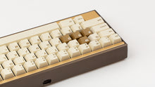 Load image into Gallery viewer, GMK CYL Rainbow 6 Siege - Winner's Circle on a Dark Gold Keycult Zero with Gold HHKB accent bars back view close up on left side angled