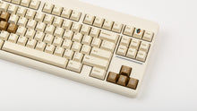 Load image into Gallery viewer, GMK CYL Rainbow 6 Siege - Winner's Circle on a beige CLASSIC-TKL close up on right side