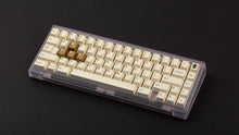 Load image into Gallery viewer, GMK CYL Rainbow 6 Siege - Winner's Circle on a Clear PC keyboard angled
