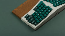 Load image into Gallery viewer, GMK CYL Taiga R2 keycaps on white ergonomic Alice keyboard with walnut wrist rest, close-up of right side showing modifiers on green background