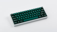 Load image into Gallery viewer, GMK CYL Taiga R2 keycaps on white 65% keyboard with gold accent, top-down angled wide view