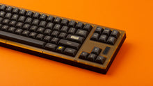 Load image into Gallery viewer, GMK MTNU 800 on a translucent orange and black keyboard close up on right side