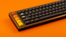 Load image into Gallery viewer, GMK MTNU 800 on a translucent orange and black keyboard close up on left side