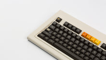 Load image into Gallery viewer, GMK MTNU 800 on a beige keyboard angled close up on left side