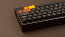 Load image into Gallery viewer, GMK MTNU 800 on a dark gold and black Keycult Zero back view close up on right side