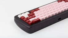 Load image into Gallery viewer, GMK MTNU Darling on a purple keyboard back view close up on right side