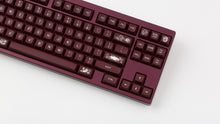 Load image into Gallery viewer, GMK MTNU Rascals on a burgundy Keycult No. 1 TKL keyboard close up on right side