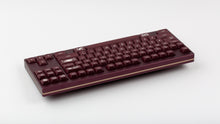 Load image into Gallery viewer, GMK MTNU Rascals on a burgundy Keycult No. 1 TKL keyboard back view