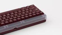 Load image into Gallery viewer, GMK MTNU Rascals on a transparent keyboard close up back view on left side