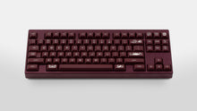 Load image into Gallery viewer, GMK MTNU Rascals on a burgundy Keycult No. 1 TKL keyboard