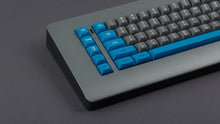 Load image into Gallery viewer, GMK MTNU Space Cadet on a grey keyboard closeup on left side