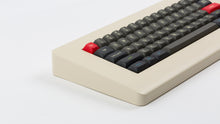 Load image into Gallery viewer, MTNU Susu on a beige keyboard zoomed in on left
