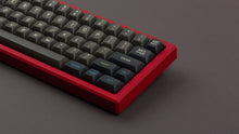 Load image into Gallery viewer, MTNU Susu on a red keyboard zoomed in on right