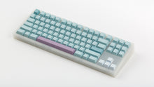 Load image into Gallery viewer, Key kobo Glacier on a translucent NK87 angled