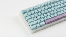 Load image into Gallery viewer, Key kobo Glacier on a translucent NK87 zoomed in on left