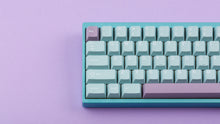 Load image into Gallery viewer, Key kobo Glacier on a blue keyboard zoomed in on left