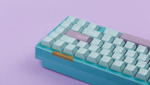 Load image into Gallery viewer, Key kobo Glacier on a blue keyboard back view right side