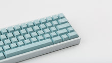 Load image into Gallery viewer, Key kobo Glacier on a white keyboard zoomed in on right